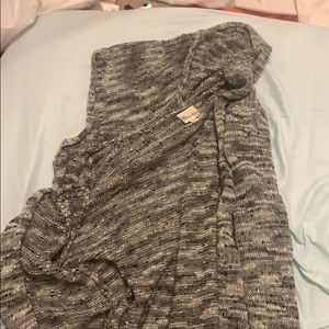 It has a hoodie and it is a really soft cardigan